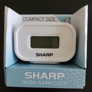 Sharp digital alarm clock white, good for travel, easy to use.